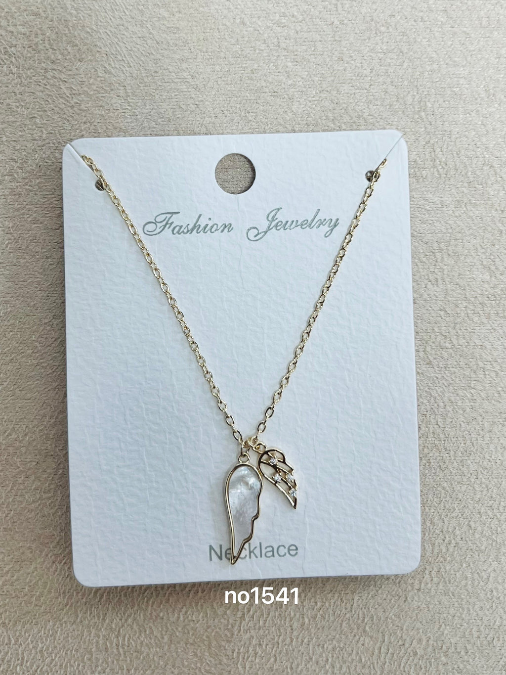 Mother of Pearl Angel Wing C.Z Rhodium Plated necklace