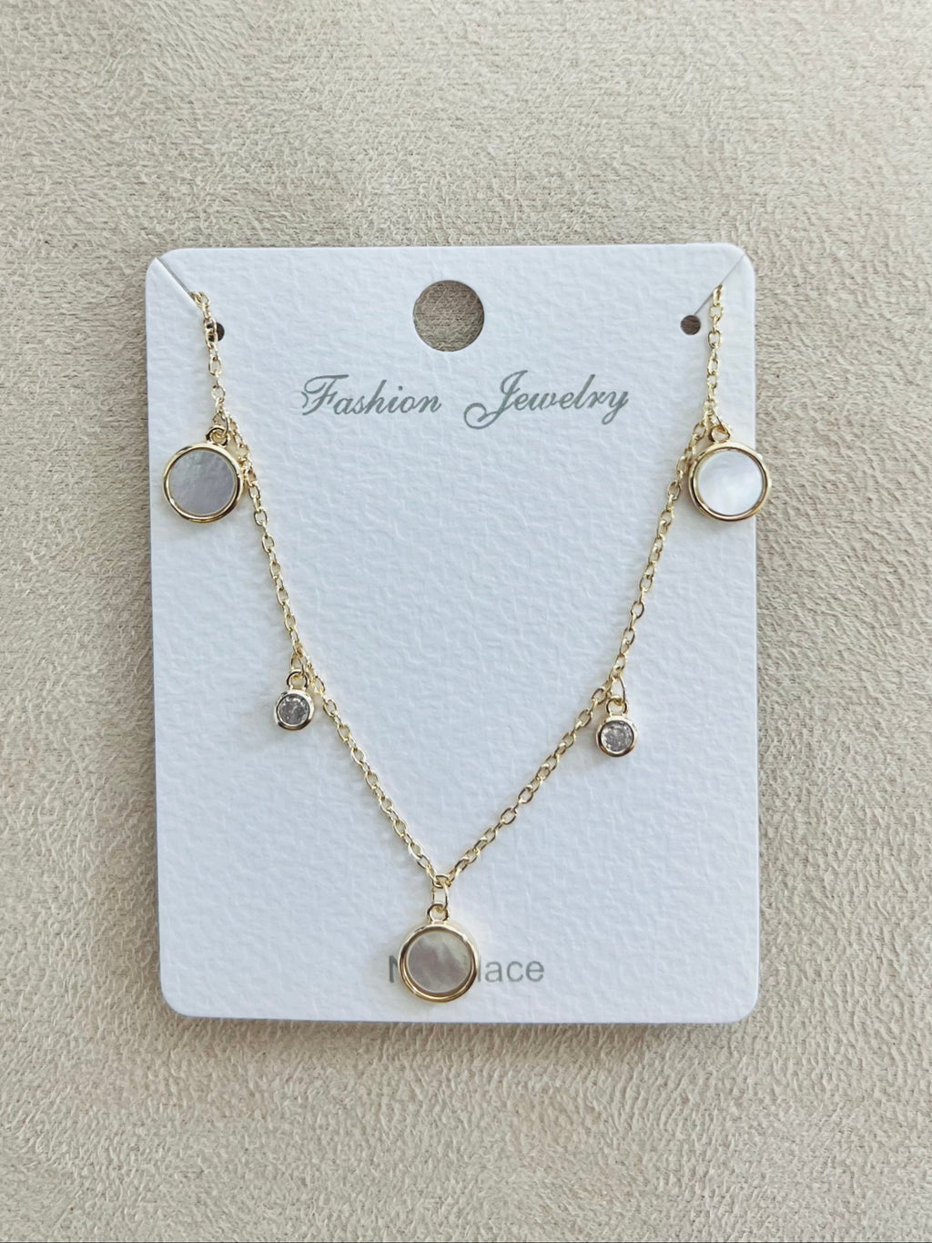 Multi-Charm with Mother of Pearl C.Z Rhodium Plated Necklace