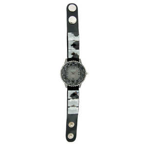 FANCY STRAP WATCH, ROUND FACE WITH SQUARE CRYSTALS AND BUTTON.