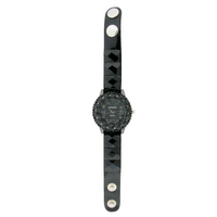 FANCY STRAP WATCH, ROUND FACE WITH SQUARE CRYSTALS AND BUTTON.